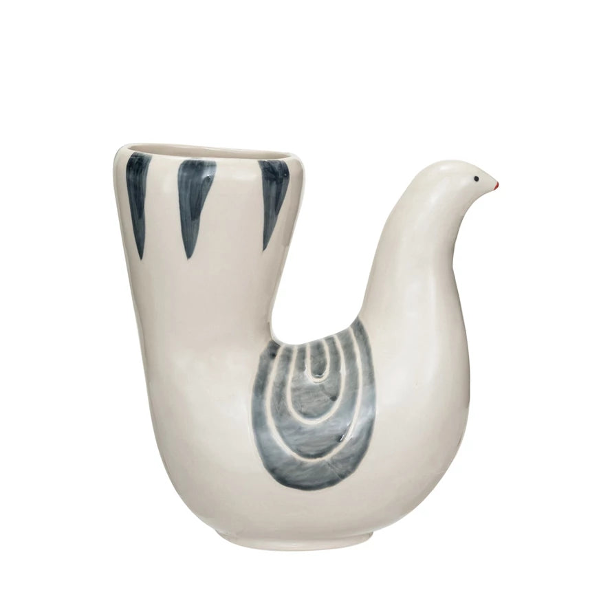 This hand-painted stoneware vase captures the essence of tranquility with its dove shape and a harmonious blend of white, grey, and blue hues. Its design evokes a sense of peace and elegance, making it more than just a vessel for flowers but a statement piece that enhances the decor of any room. Crafted from durable stoneware, it promises longevity and ease of maintenance, while its dimensions ensure it is a versatile addition to any interior