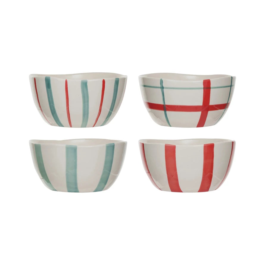 Add a pop of color to your kitchen with our hand-painted stoneware bowls! Available in red, aqua, and cream, each bowl is uniquely crafted in one of four styles. Bring a touch of whimsy to your meals with these quirky and playful pieces.