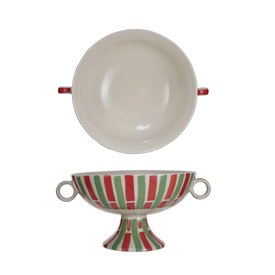 This festive footed bowl is a stunning piece that stands out with its hand-painted stripes and a trio of colors that embody the holiday spirit.