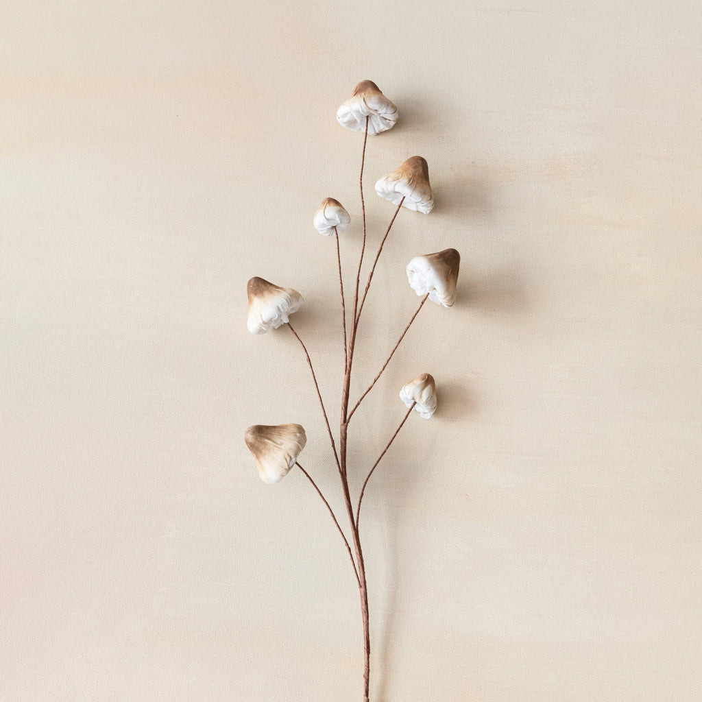 This foam and fabric mushroom spray is a whimsical and adorable piece that will enhance any space. The spray features a brown and cream color scheme that has a cozy and elegant effect, creating a warm and inviting atmosphere. The spray also features a faux spray design that gives it a realistic and natural appeal, creating contrast and balance. The spray is made of foam and metal, with a soft and flexible quality. It is easy to clean and maintain.