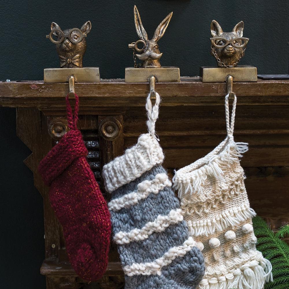 Introducing Eric the Hare Stocking Holder - the perfect addition to your holiday decor! With its playful design and sturdy construction, this holder will keep your stockings in place and add a touch of whimsy to your mantel. Don't miss out on the hoppiest way to decorate for the season!