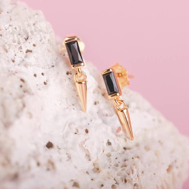 You'll be the center of the galaxy with these earrings. Featuring a clear baguette CZ and pointed dangle, these earrings are the perfect accent to bring a touch of intergalactic edge to your look.

• 925 sterling silver with gold plating

• Extra layer of tarnish resistance

• 13.2 mm long

• Manufactured for our curated collection.